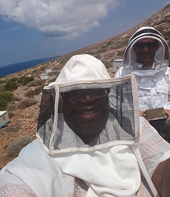 Senior Deborah Alves with the bees in Greece for her Rosen project. 