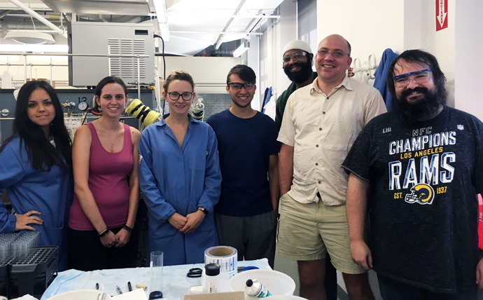  Chemistry Professor Ryan Murelli, second from right, with his research team.